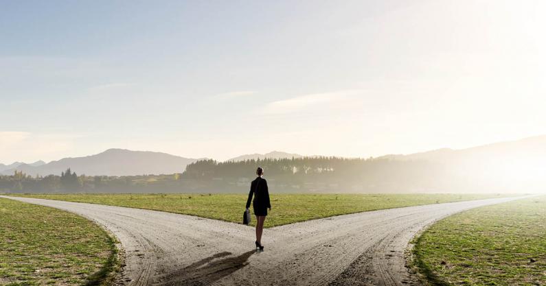 Photo of a business woman at a crossroads