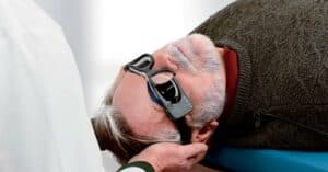 Photo of an older man receiving vestibular testing