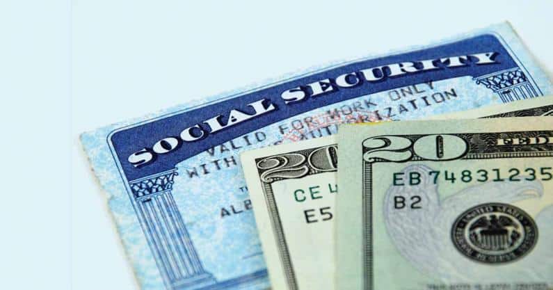 Close-up of of social security card and money