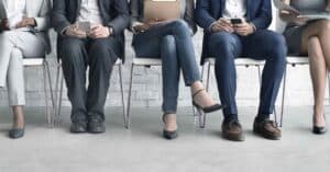 Photo of a group of candidates interviewing for a job - Negotiating Salary as a New Graduate and Its Impact on the Future of Our Profession Article