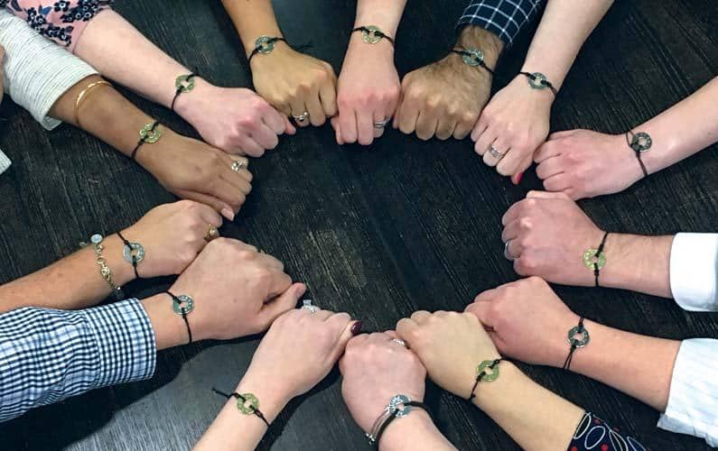 Close-up of the winning recipients bracelets on their wrists