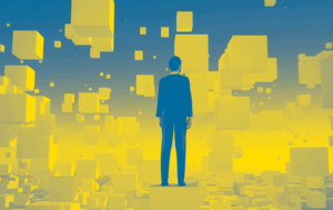 Photo illustration of business man standing on cube with floating cubes surrounding him