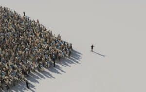 Photo of a crowd of people with a leader leading the way