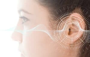 Close-up illustrated photo of a woman with hearing analysis - ACAE CORNER | Practicing Preventive Audiology: Promoting Healthy Hearing Article