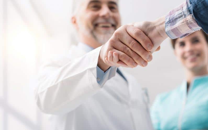 Photo of two men shaking hands