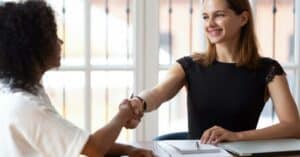 Photo of audiologist greeting a patient before consultation.