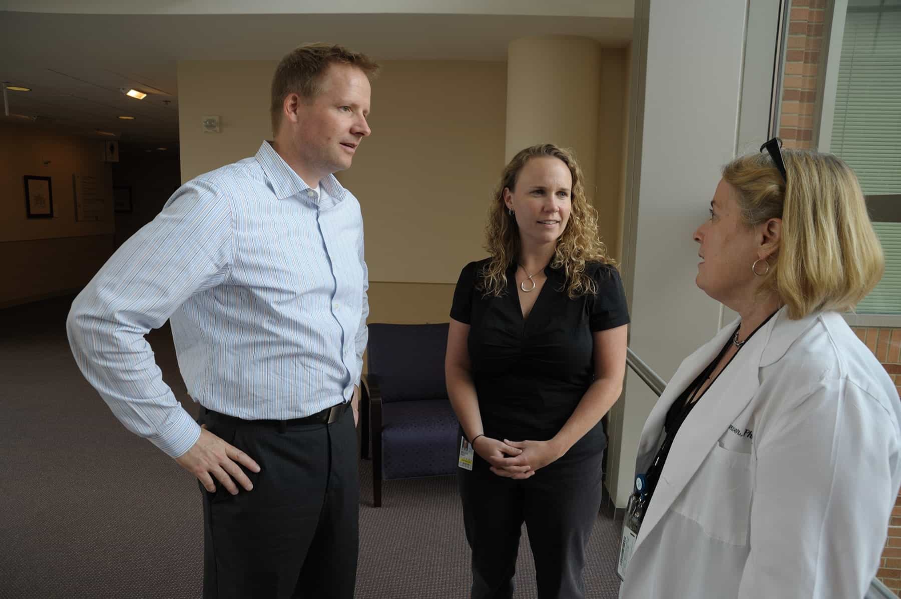 Colleagues-discussing-hearing-information-NIDCD-2021-05 Colleagues discussing hearing information