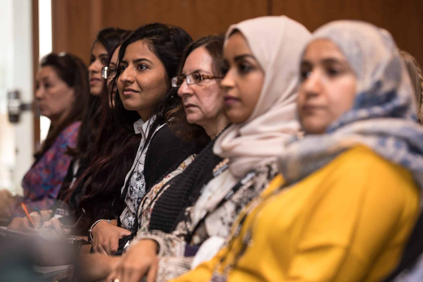 attendees-listening-in-at-conference-3-academy-2021-05 Academy conference members listening during conference presentation