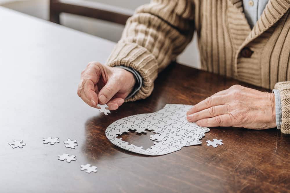 Older adults with dementia brain puzzle.