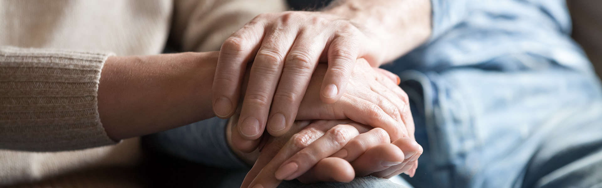 dementia people holding hands