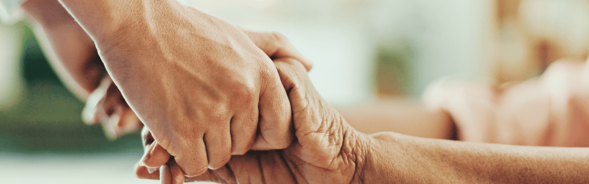 Nurse, holding hands and elderly care with empathy for love, assisted living or support at old age home. - Audiology Services in Nursing Homes and Communal Living