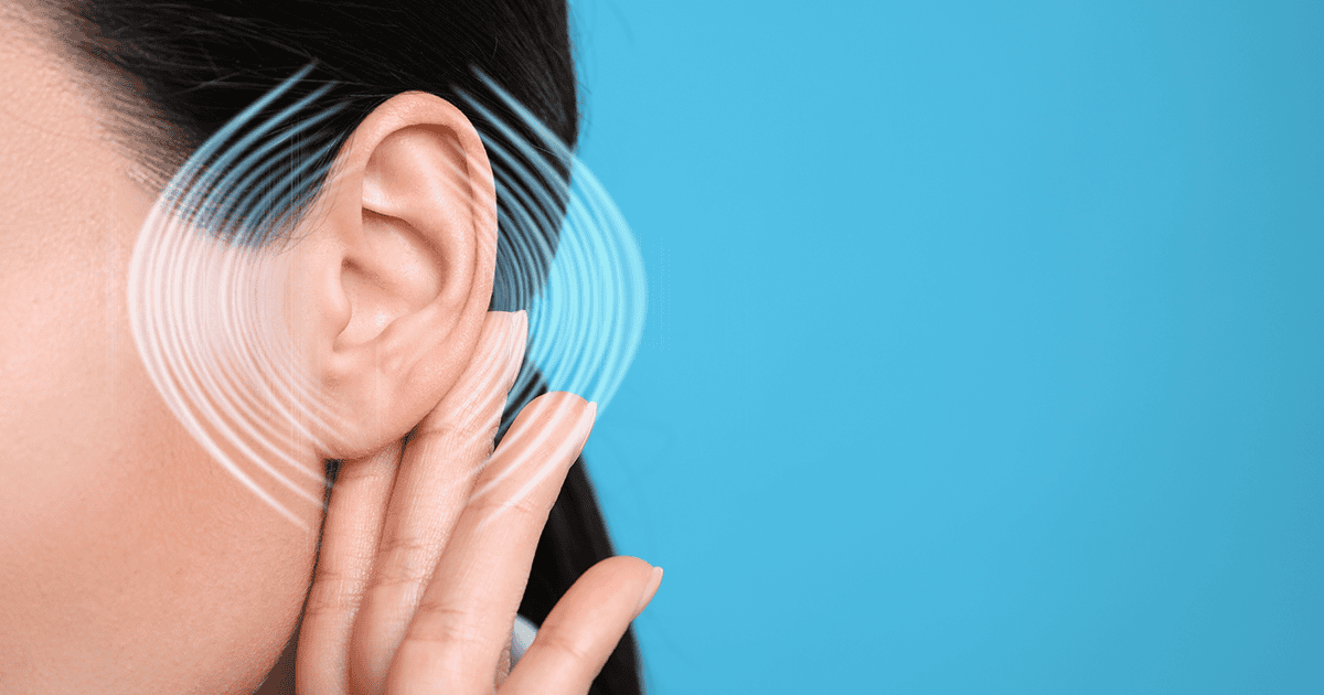 Woman with audio waves around her ear on blue background, closeup - Americans Do Not Understand the Importance of Hearing Health