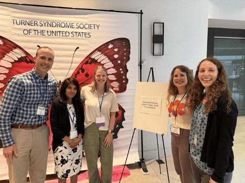 A multidisciplinary team from Wake Forest Baptist/Brenner Children’s Hospital spent the day serving participants at the Turner Syndrome Society of the U.S. conference in North Carolina.
From left to right: Audiologist Dr. Sam Brown, Endocrinologist Dr. Nandini Vijayakanthi, Audiologist Dr. Amanda Donaldson, Audiologist Dr. Ashleigh Starnes, and neuropsychologist Dr. Lia Thibodaux.
