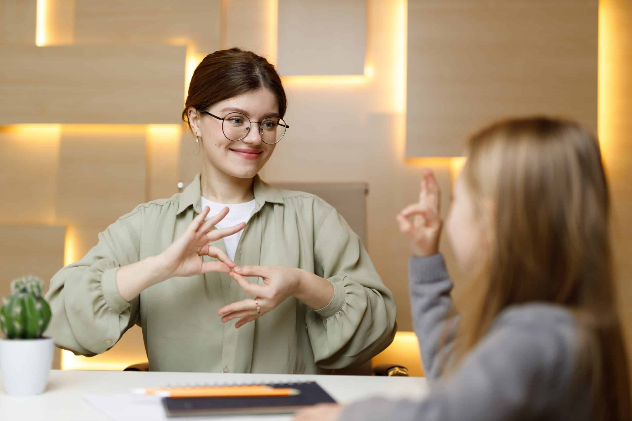 Learning,Sign,Language,,Cheerful,Woman,Communicates,With,A,Child.,School