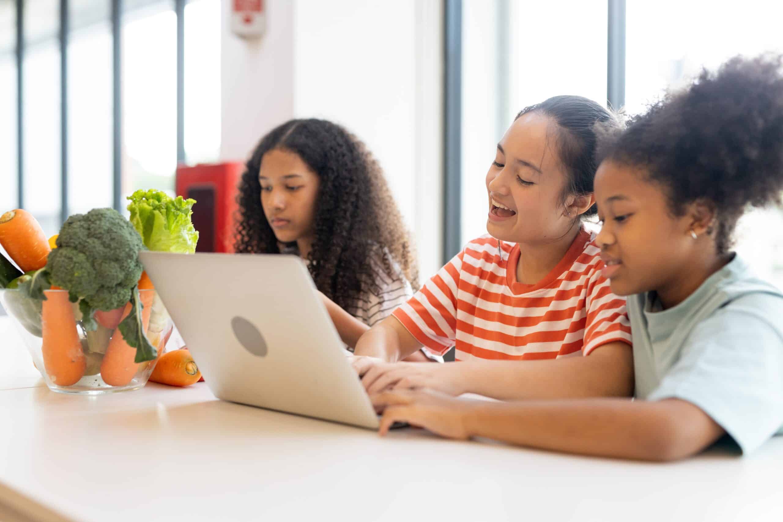 Diverse,Group,Of,Kids,Three,Girls,Happy,Looking,At,Computer
